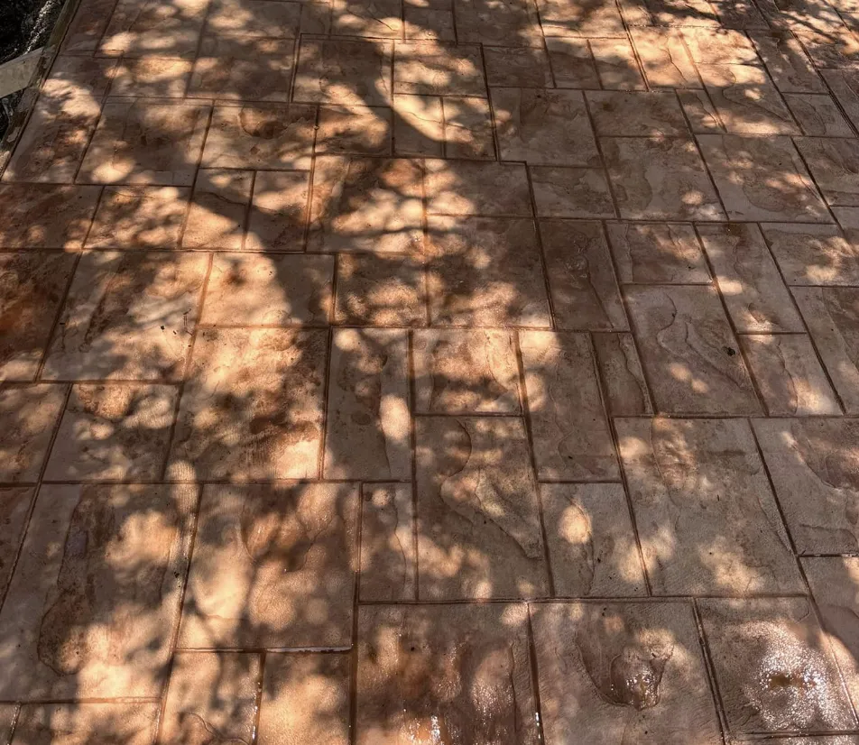 Glossy resealed colored stamped concrete project in Tulsa, Oklahoma