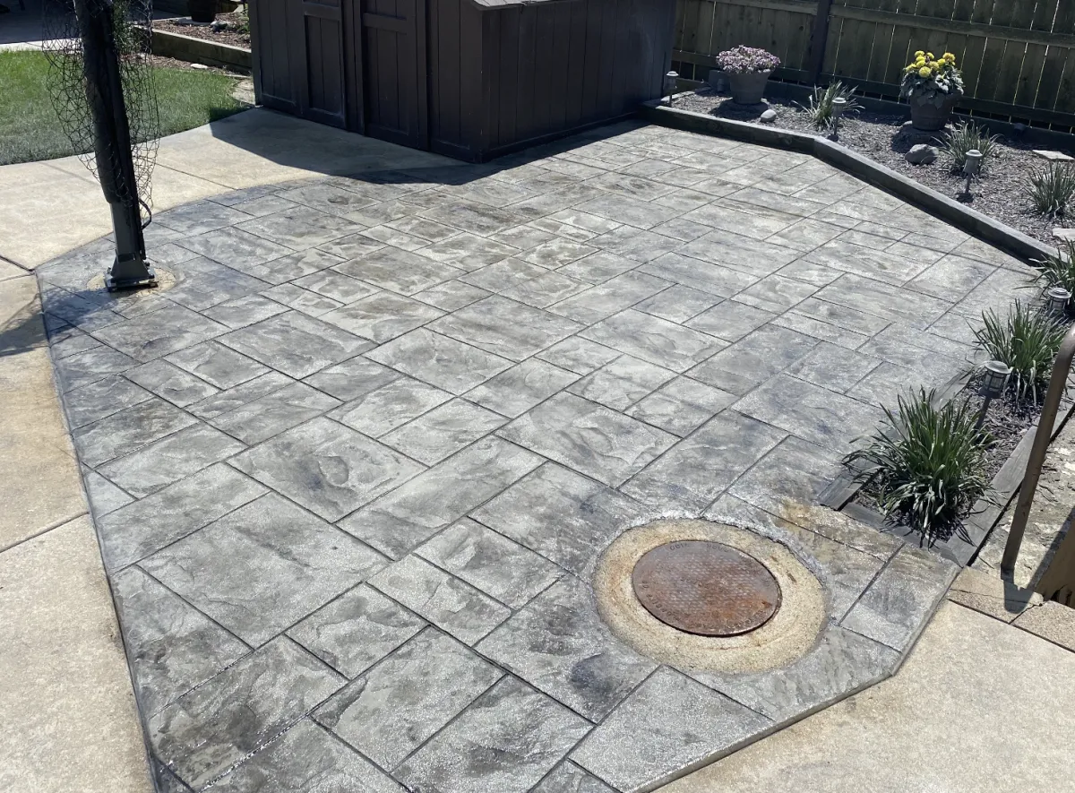 Stamped concrete patio with fire pit near Catoosa, OK