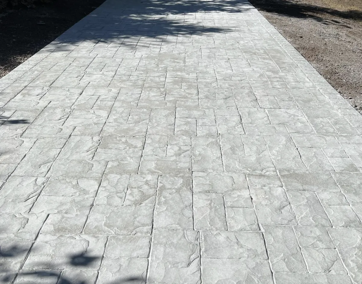 Stamped concrete contractor finishing a decorative concrete project in Tulsa, Oklahoma