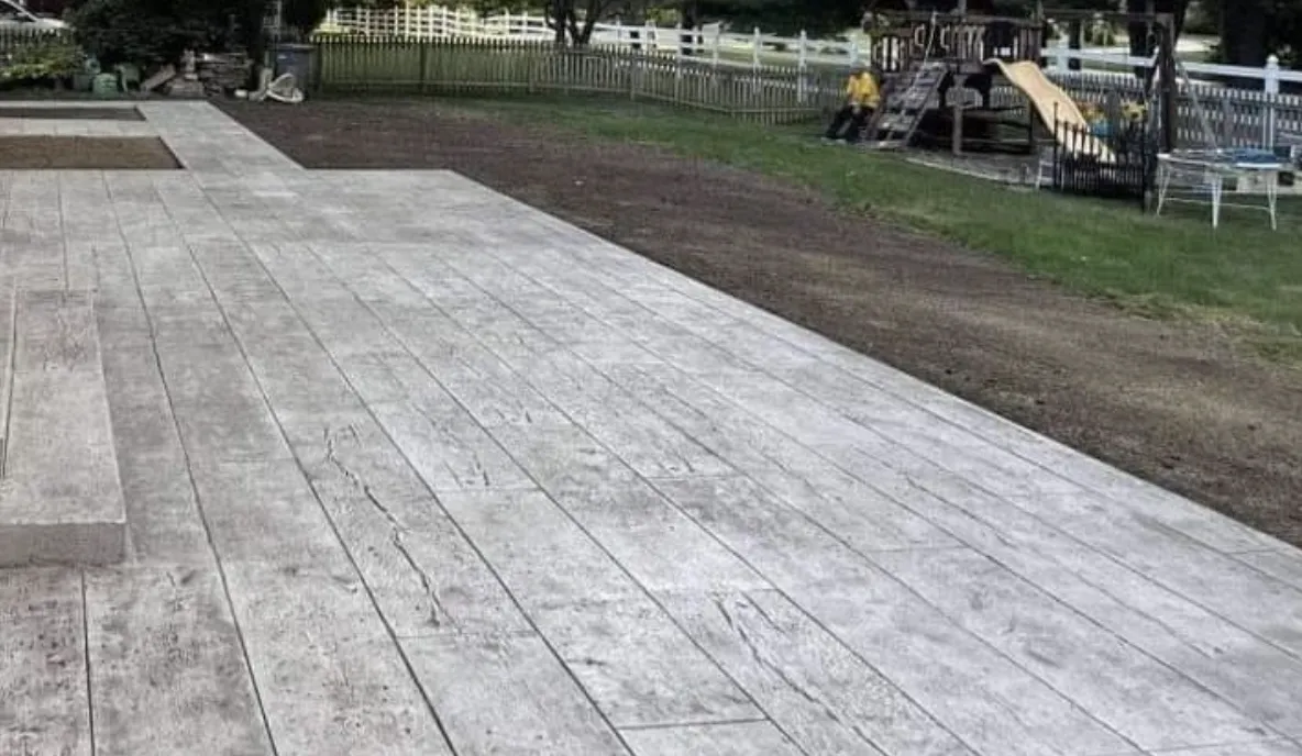 Stamped concrete overlay used to resurface an existing pool deck in Tulsa, Oklahoma